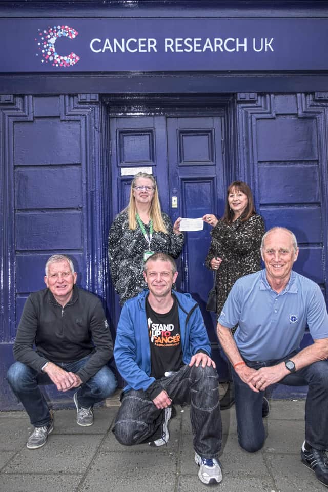 Hugh’s wife, Mags Wright (top right), handed over the cheque at the Cancer Research UK shop in High Street, Linlithgow. Left to right Yvonne Stevenson, Mags Wright, Ian Shiells, David Thornton, Colin Fowler.