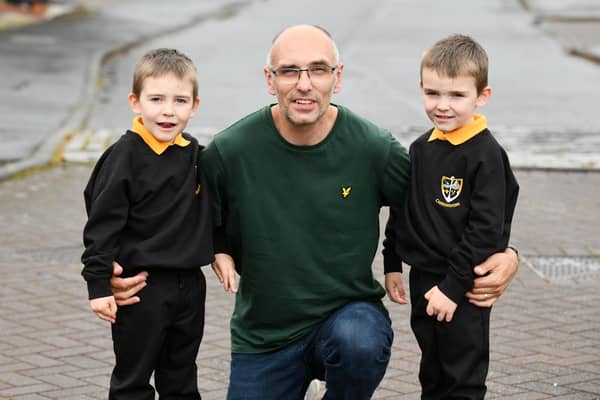 Kerr, left, and Lewis Shepherd with dad Paul. Pic: Michael Gillen