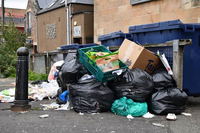 Street cleansing teams have a massive task to remove rubbish piled up in streets
