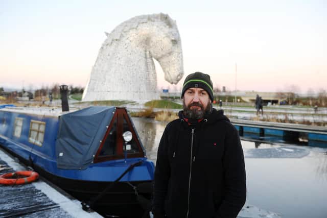 Robert Fettes 54 who lives on the canal used his barge to break up the ice and help rescue the dog picture: Michael Gillen