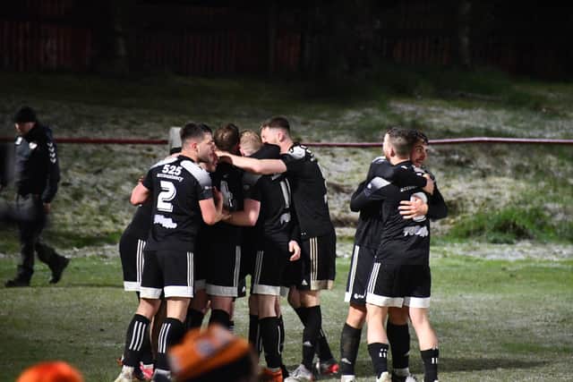 Syngenta players celebrate Ryan Millar's last minute goal to win the match