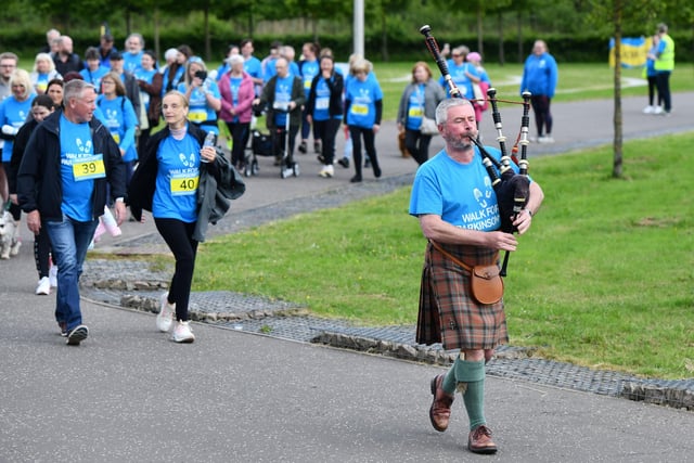 Piper Neil Clark of Falkirk Piping leads off the walkers