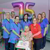 Annette Hall was born on the day NHS was founded on July 5, 1948 - pictured with staff and carers from Cunningham House in Grangemouth. Pic: Michael Gllen