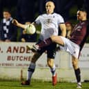 Ruari MacLennan (right) pictured playing for Linlithgow Rose against Falkirk in a Scottish Cup tie in 2019