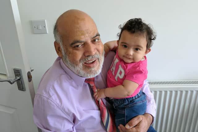 Mohammad with his granddaughter Manha.
