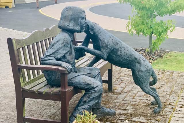 Girl and her Dog was created by sculptor David Annand and unveiled in 1996.