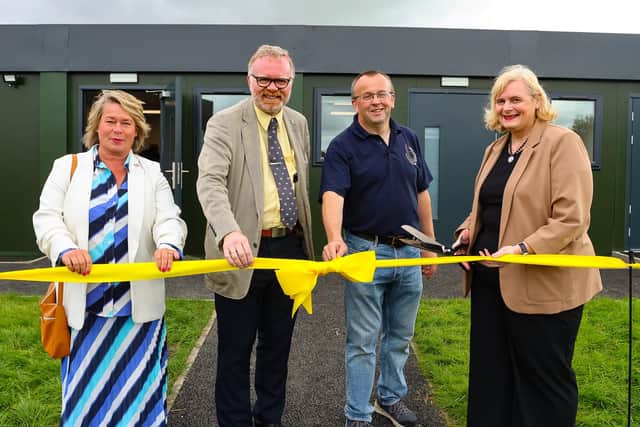 The official opening of Bailliefields Community Hub by Falkirk Council leader Cecil Meiklejohn, watched by, left to right, Michelle Thomson MSP, Martyn Day MP and Stephen Sutton, chairperson. Pic: Scott Louden