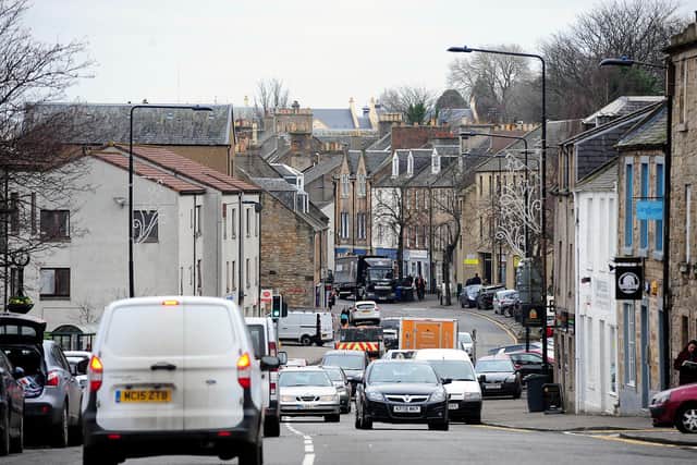 Linlithgow's High Street has been closed by police over a report of a damaged chimney. Picture: Michael Gillen.
