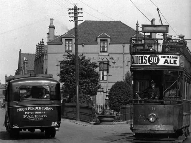 Tram No.6 and Pender's bus at the Plough Hotel in Stenhousemuir in 1929. Pic: Contributed