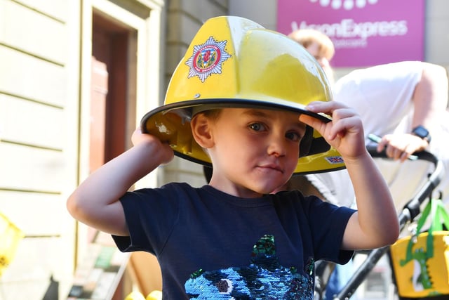 Lewis Shepherd, three, of Carronshore tries out a firefighter's helmet for size