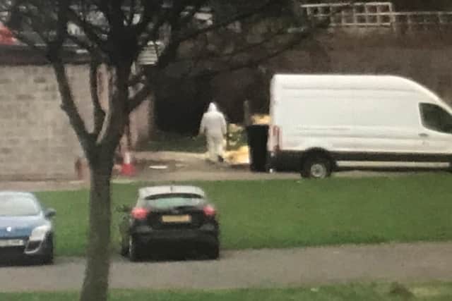 Workers dispose of the refuse at the rear of Camelon Labour Club
