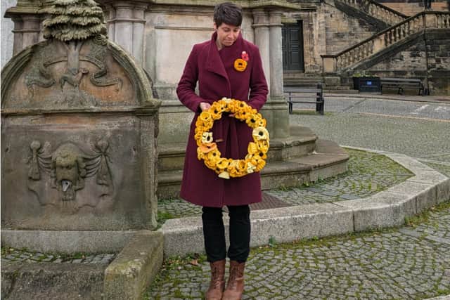 Local researcher Kathryn Welch is pictured with the handmade wreath which will be placed at the Regent Centre today and remain in place until the end of Armistice Day on Monday.