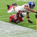 Saquon Barkley of the New York Giants scores a touchdown during the fourth quarter in the game against the Arizona Cardinals at State Farm Stadium on September 17, 2023 in Glendale, Arizona