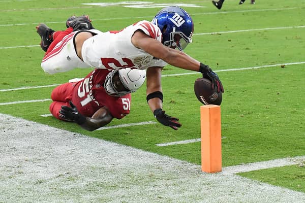 Saquon Barkley of the New York Giants scores a touchdown during the fourth quarter in the game against the Arizona Cardinals at State Farm Stadium on September 17, 2023 in Glendale, Arizona