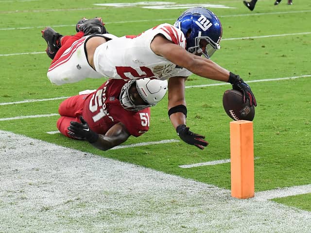 Saquon Barkley of the New York Giants scores a touchdown during the fourth quarter in the game against the Arizona Cardinals at State Farm Stadium on September 17, 2023 in Glendale, Arizona