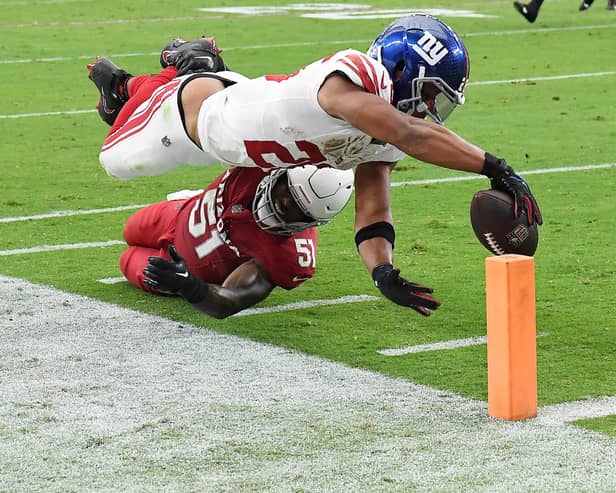 Saquon Barkley of the New York Giants scores a touchdown during the fourth quarter in the game against the Arizona Cardinals at State Farm Stadium on September 17, 2023 in Glendale, Arizona