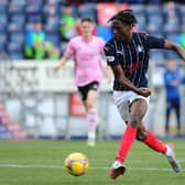 Samuel Ompreon goes for goal against Peterhead's Brett Long (Pictures by Michael Gillen)