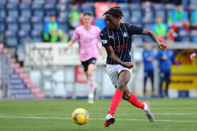 Samuel Ompreon goes for goal against Peterhead's Brett Long (Pictures by Michael Gillen)