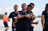 Callumn Morrison celebrates his stunning strike to open the scoring (Photos: Michael Gillen)