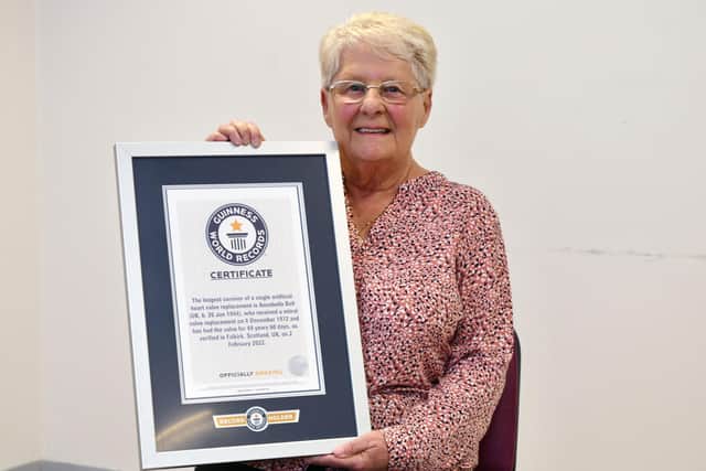 Ann Bell with her certificate to confirm she is Guinness World Record holder as longest surviving recipient of a single artificial heart valve replacement. Pic: Michael Gillen