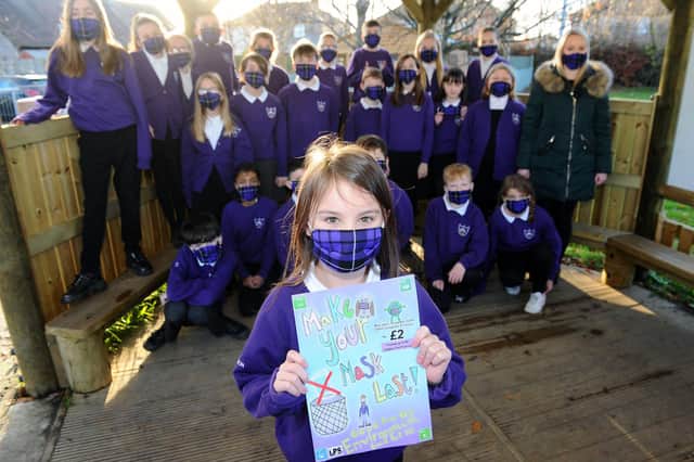 Langlees Primary School P6 pupils selling and promoting reusable face masks (Pic: Michael Gillen)