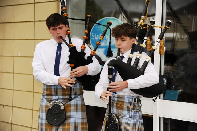 Pipers played for the store opening.