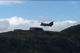 A Chinook lands on Inchkeith during military exercises.