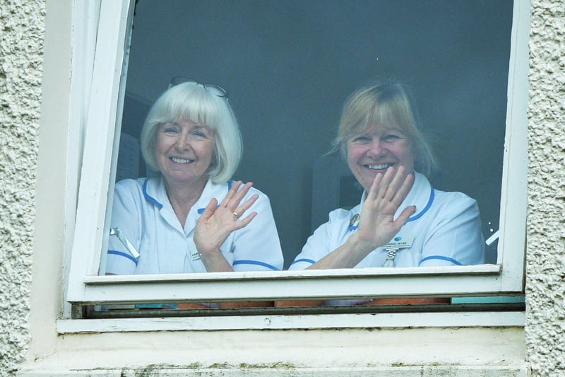 Strathcarron Hospice staff watching from the window as they wait on the arrival of the Princess Royal.