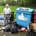 Former councillor Dennis Goldie is concerned about the eye-sore and health risk from the fly-tipping. Pic: Michael Gillen