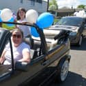 Cars containing Slamannan and Limerigg Gala Day retinue members toured the villages on Saturday. Picture: Michael Gillen.