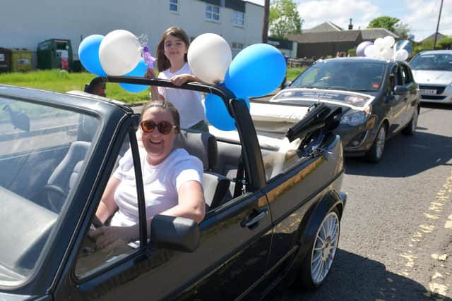Cars containing Slamannan and Limerigg Gala Day retinue members toured the villages on Saturday. Picture: Michael Gillen.