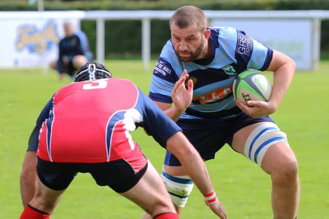 Stefan Yarrow looks to get by the Newton Stewart player