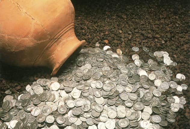 The biggest hoard of Roman coins ever found in Scotland were discovered when council workmen were digging foundations at the north end of Bells Meadow.