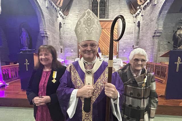 Pictured wearing their medals are Patricia McInally, left, and Rose Watt with Archbishop Leo Cushley at Christ the King Church, Grangemouth. Pic: Archdiocese of St Andrews & Edinburg