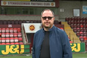David Smith oversees Stenhousemuir FC's Blether Together telephone befriending service. Picture: Michael Gillen.