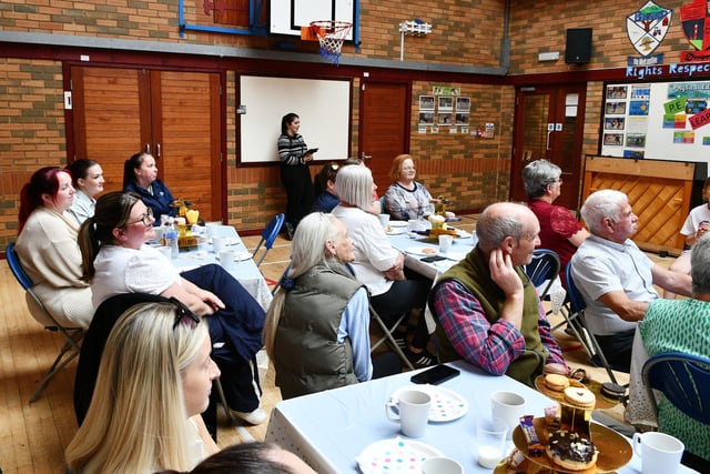 Guests at the Dunipace Primary School Thank You Tea enjoy songs from pupils and the beverages and tasty treats they served up