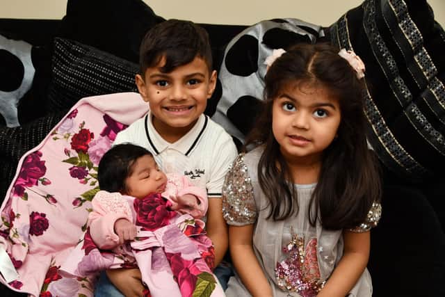 Big brother Zidan, 5, and sister, Laiba, 3, are 'over the moon' with their little sister Riyah who was born on New Year's Day.  Picture: Michael Gillen.