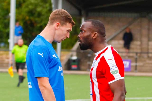 Bo'ness United v Cumbernauld Colts 23/07/22 Todd of Bo'ness diagrees with Tade of Colts
