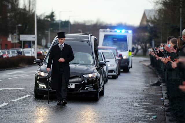 The funeral procession of Scottish Ambulance Service paramedic Rod Moore passed Falkirk Ambulance Station in Grangemouth Road where colleagues and friends paid their respects before moving on to Grandsable Cemetery in Polmont. Picture: Michael Gillen.