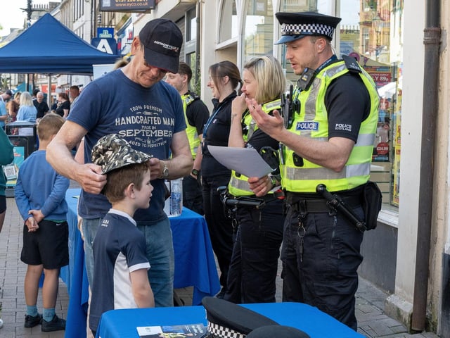 A young enthusiast learns from an officer.