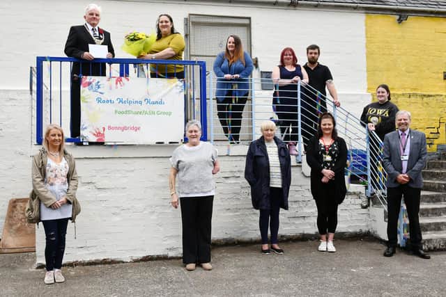 ROOTS Helping Hands volunteers at their new Bonnybridge base with Provost Billy Buchanan and Councillor David Grant. Picture: Michael Gillen.