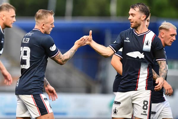Calvin Miller celebrates scoring against Saturday's opponents Queen's Park with team-mate Brad Spencer (Photo: Michael Gillen)