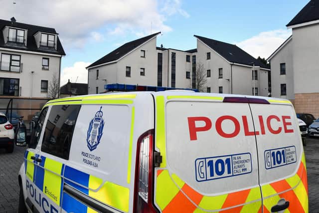 Police attend the incident at the block of flats on Falkirk Road at Anderson Park