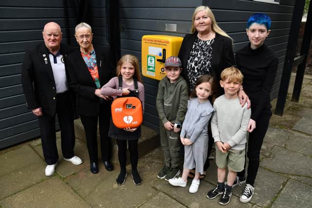 Bowling club president John Waddell is pictured with Jean Sneddon, her great grandchildren and her daughter Janice McFadden.  Picture: Michael Gillen.