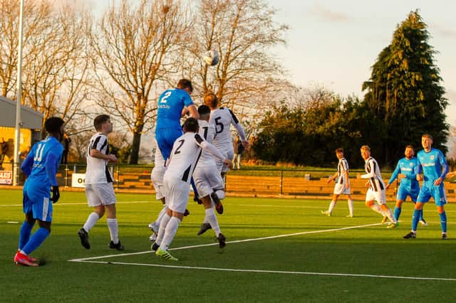 Fergus Owens goes up for a header (Pic: Scott Louden)