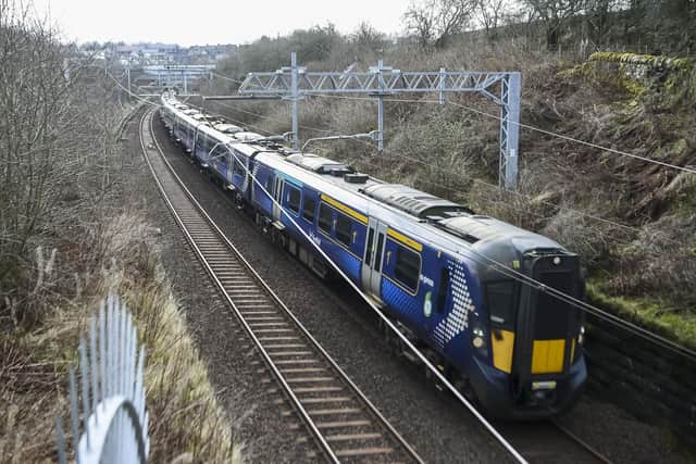 A ScotRail train on the main line passes near the site of the proposed Winchburgh Station. The previous station closed in 1930.
