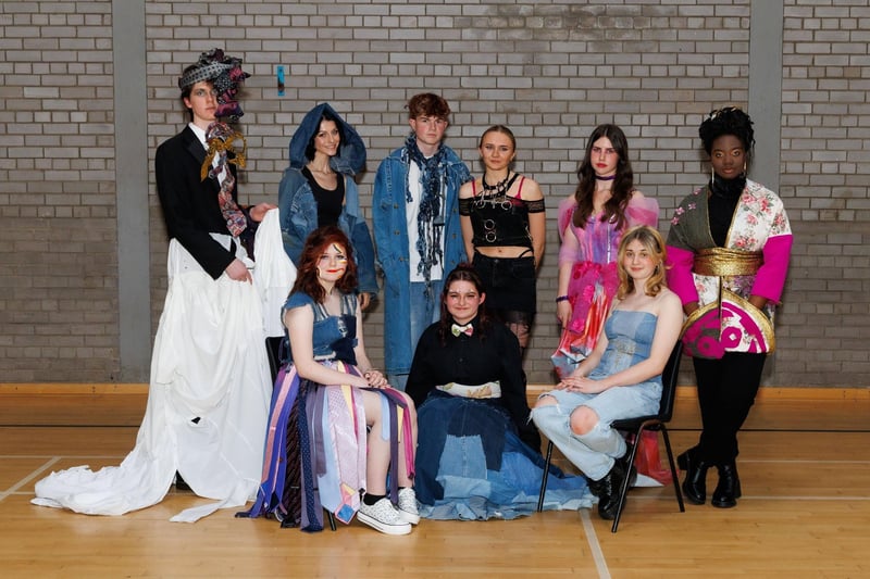 Young people modelling some of the designs students made from pre-loved garments donated to the charity.