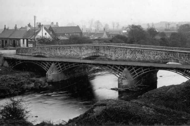The iron waggon way attached to the 1775 stone bridge over the Carron