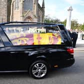 Her Majesty The Queen's coffin travels through Ballater after leaving Balmoral on the first stage of her final journey to Edinburgh. Pic: Michael Gillen