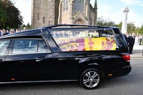 Her Majesty The Queen's coffin travels through Ballater after leaving Balmoral on the first stage of her final journey to Edinburgh. Pic: Michael Gillen